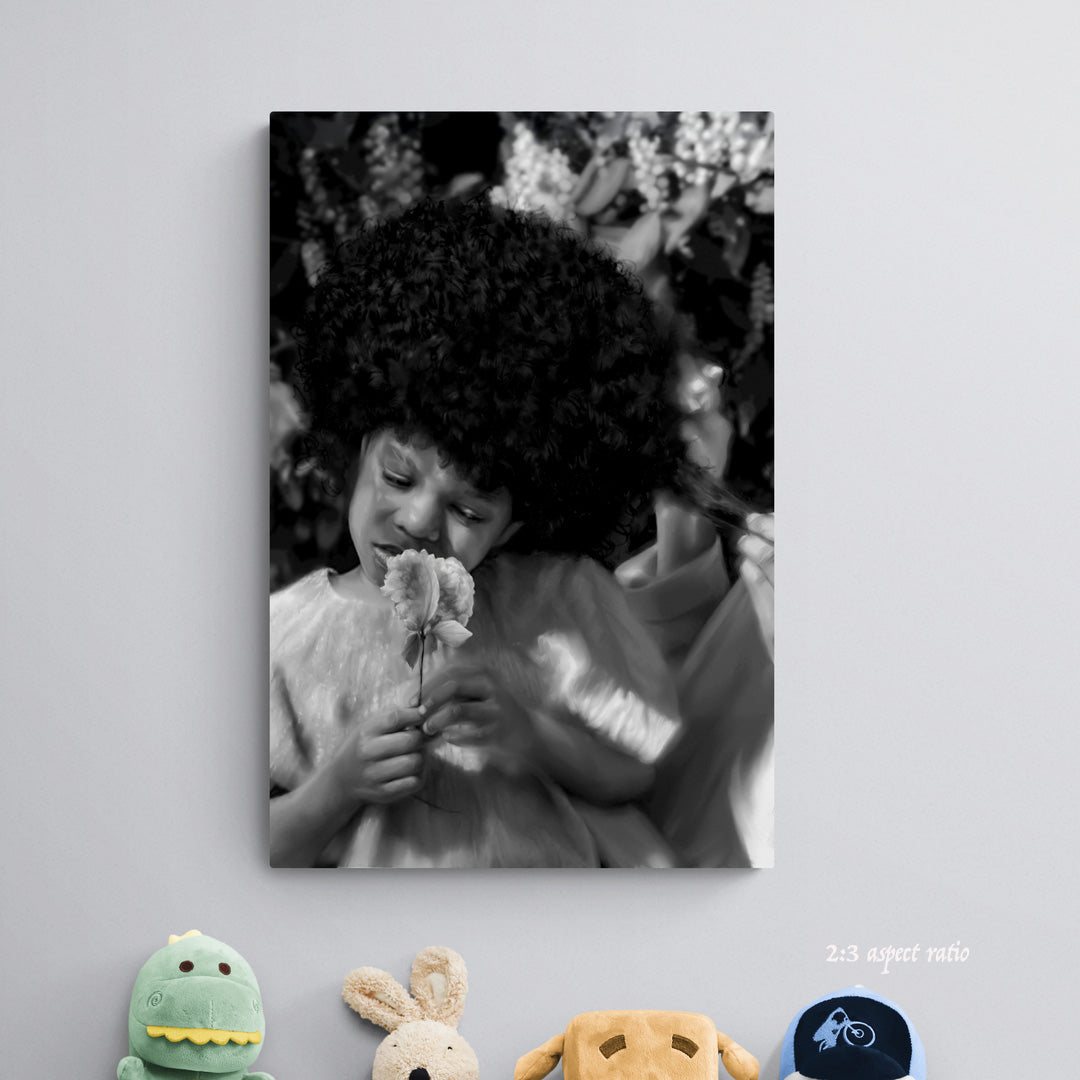 Black and white photo of a child holding a flower on a gray wall with soft toys below.