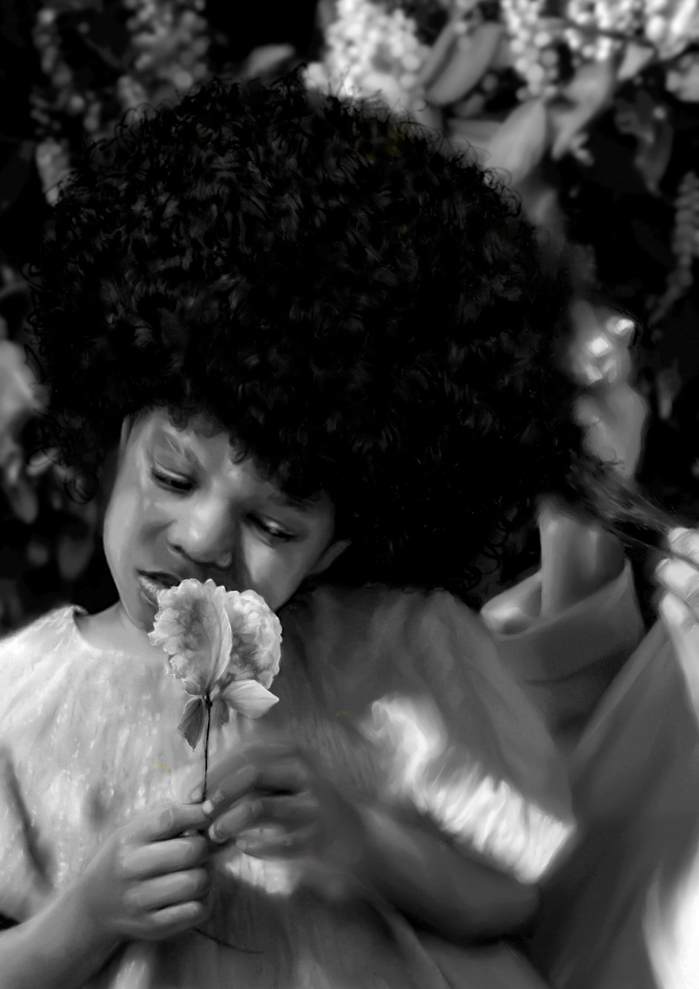Black and white photo of a child holding a flower