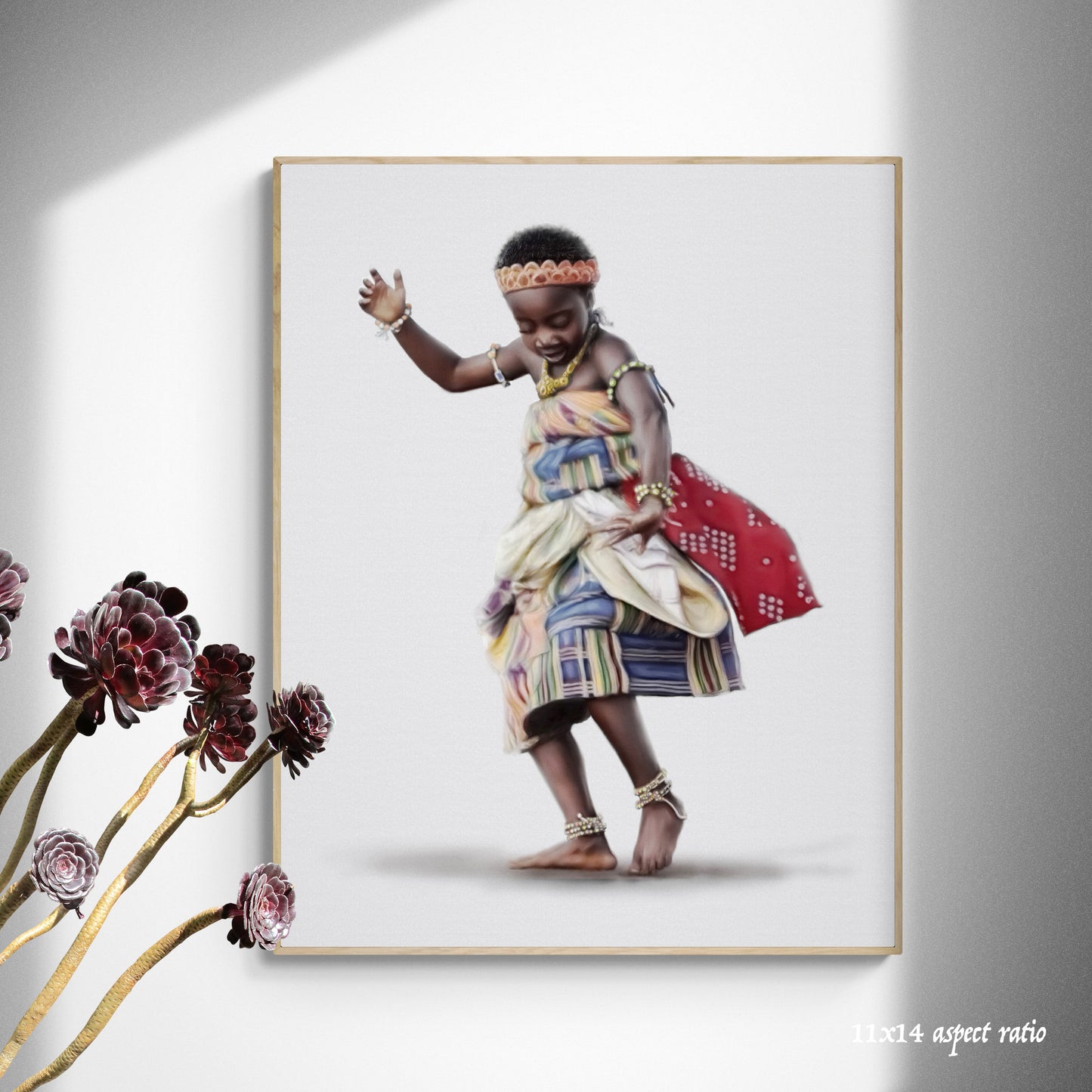 Framed artwork of a child in traditional attire on a white wall with flowers in the foreground.