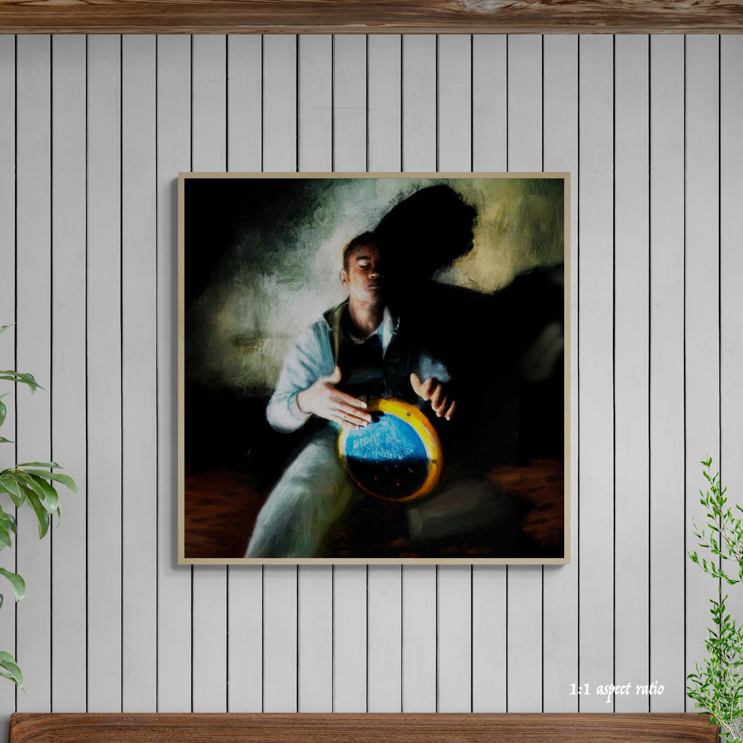 Framed artwork of a person playing a drum against a white paneled wall.