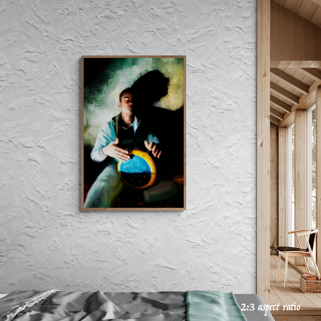 Framed artwork of a person playing a drum against a white plastered wall.